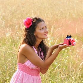 Woman Opening Gift With Lavender Fields Fragrance Oils
