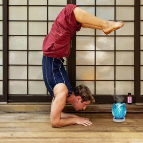 Man Doing Yoga While Burning Baby Oil Fragrance Oil